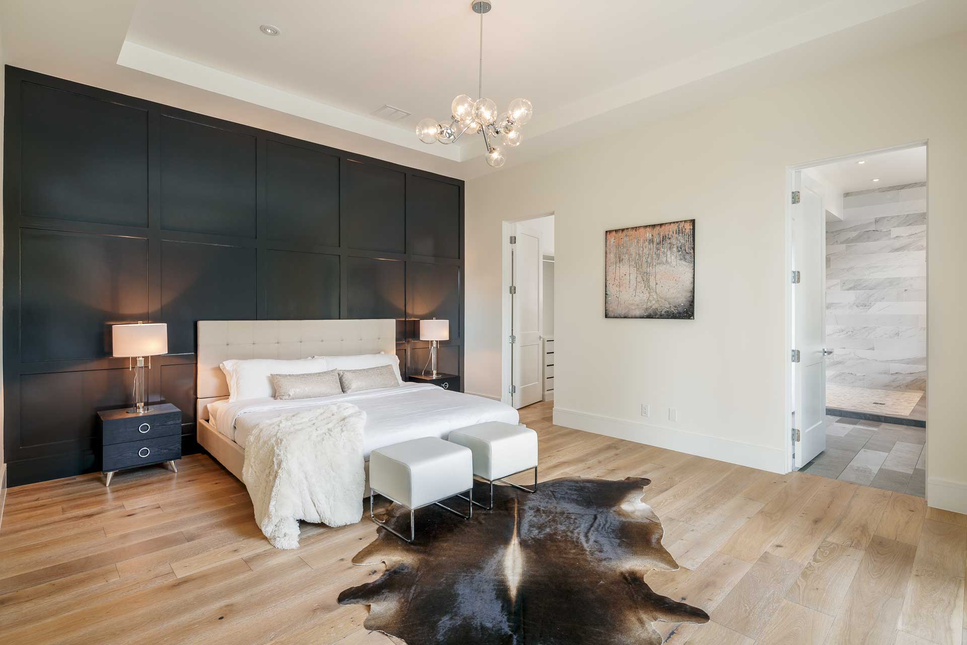 a bedroom with a bed and a rug on the floor