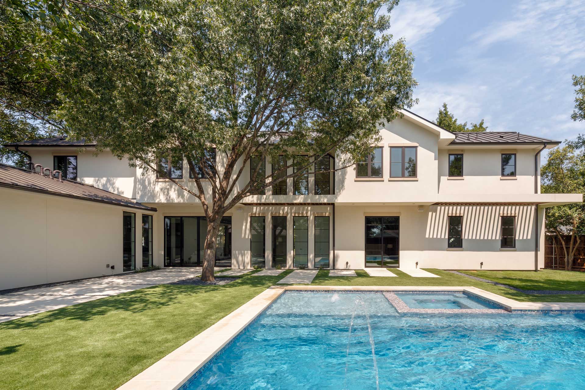 a house with a pool in the back