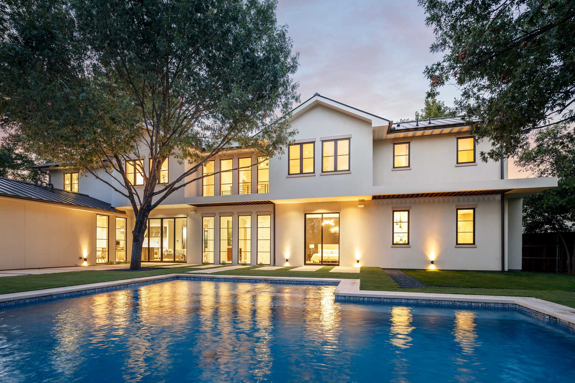 a house with a pool in the back