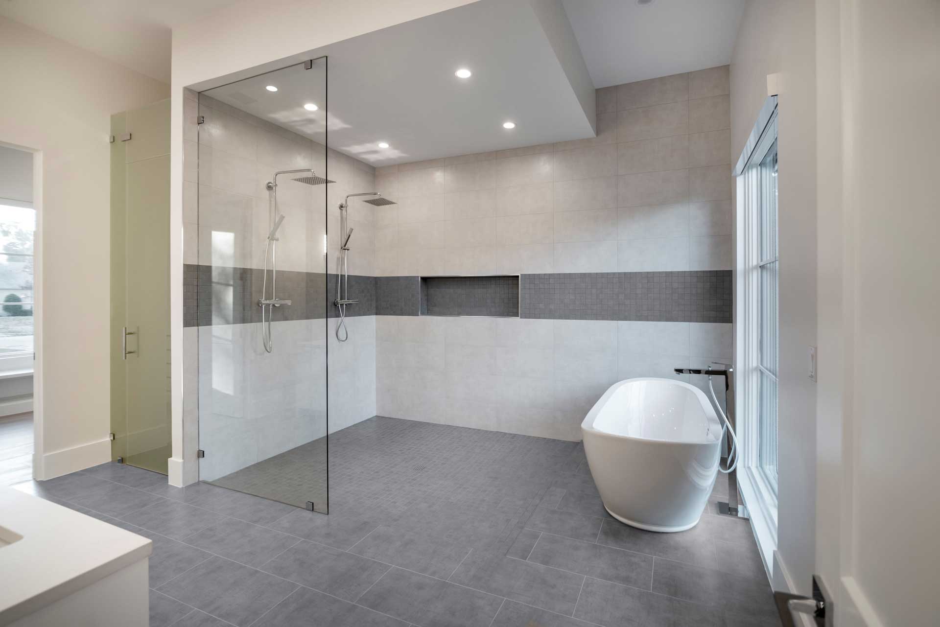 a bathroom with a glass shower and sink