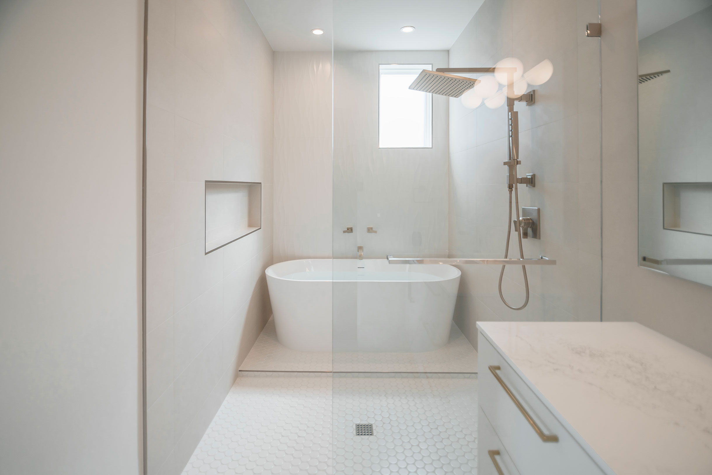 a bathroom with a tub and shower