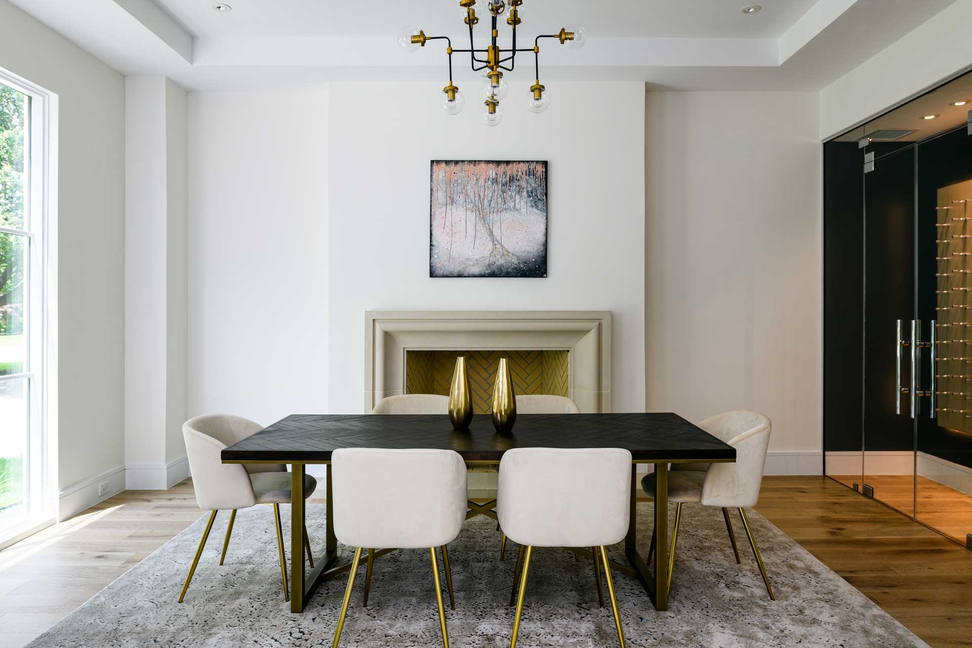 a dining room with a table and chairs