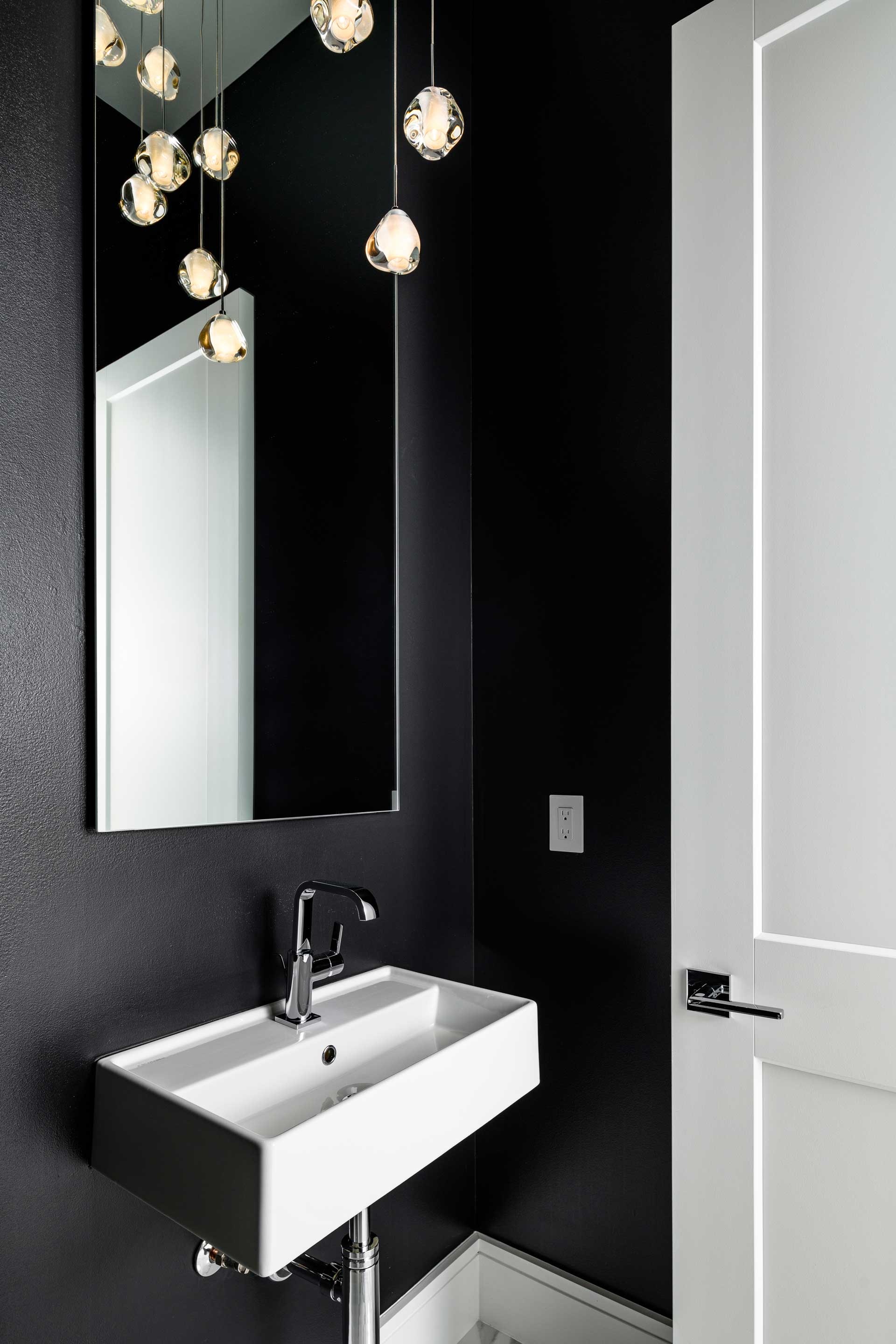 a bathroom with a mirror and sink