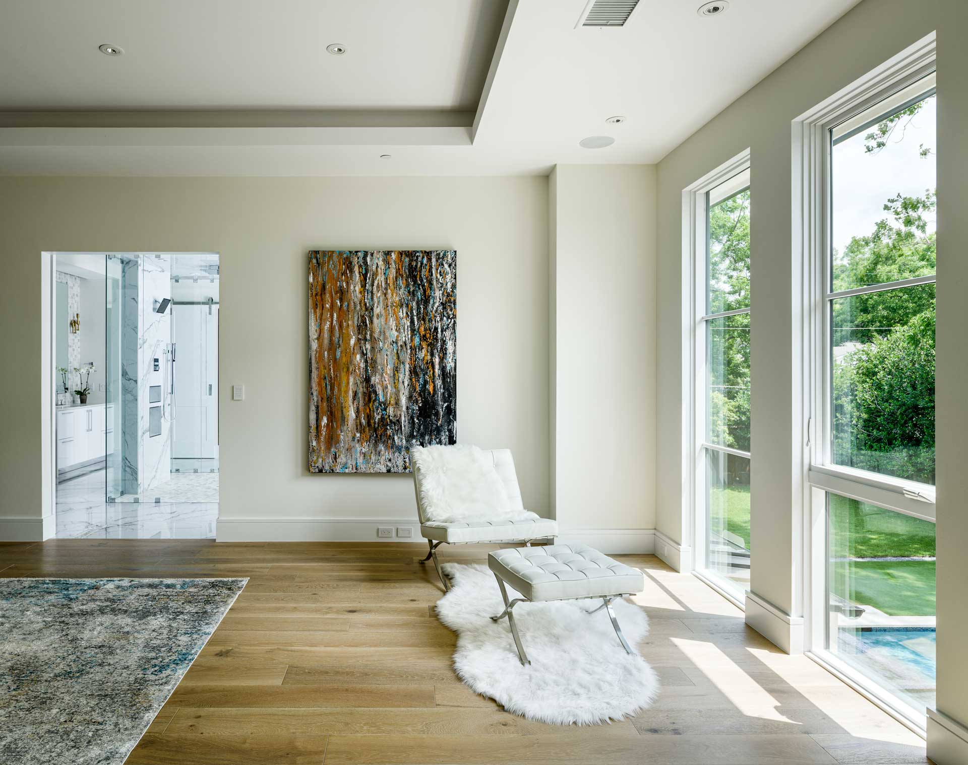 a room with a white couch and a rug