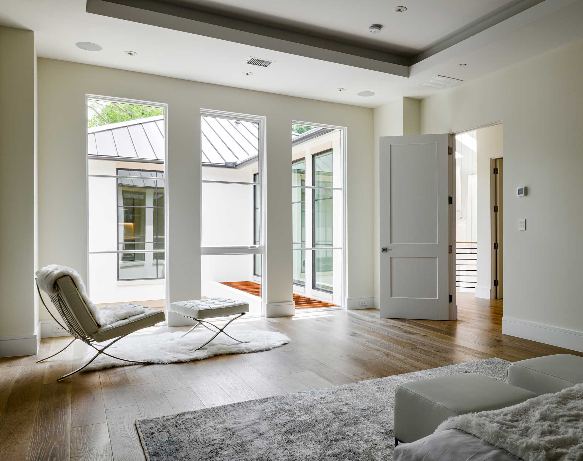 a room with a white couch and a rug