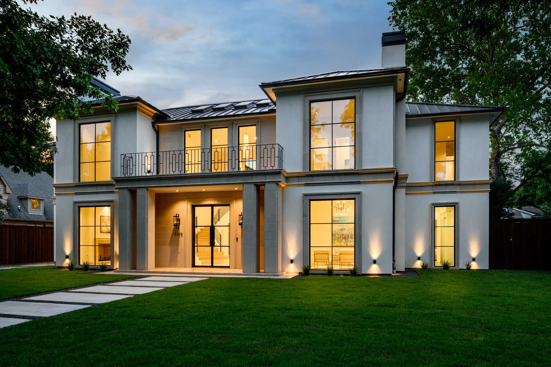 a house with a patio and a lawn
