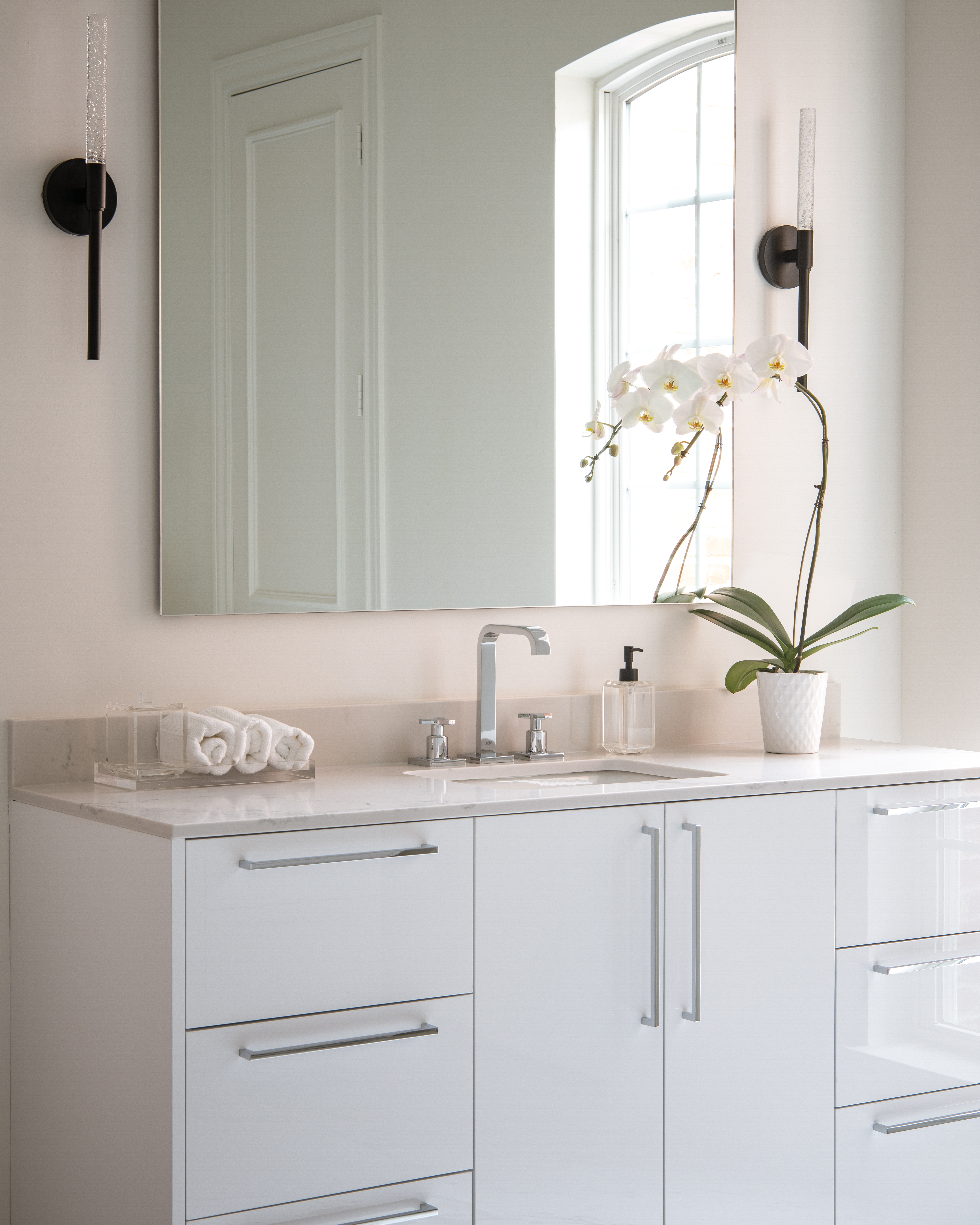 a bathroom with a mirror and a sink