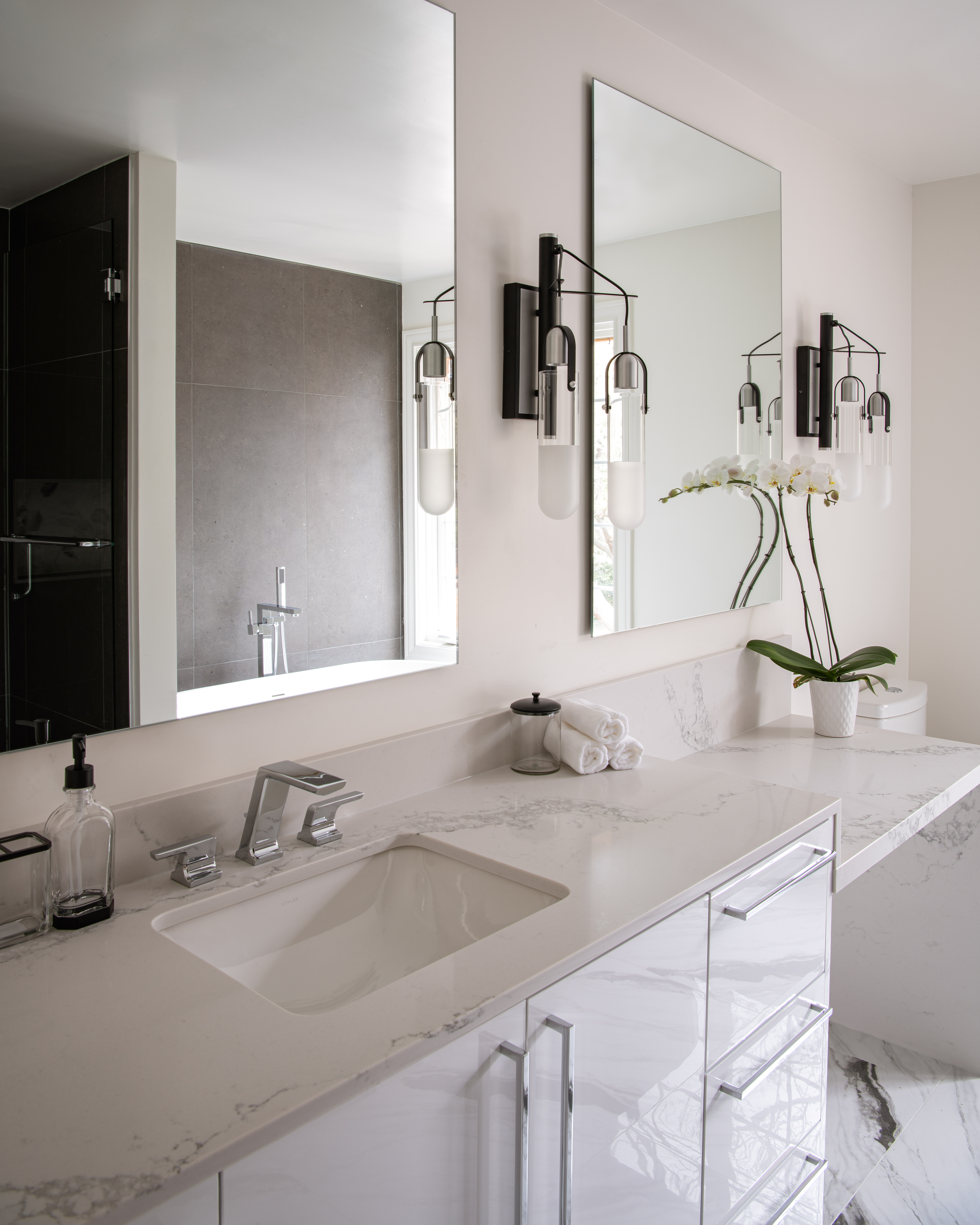 a bathroom with a mirror and a sink
