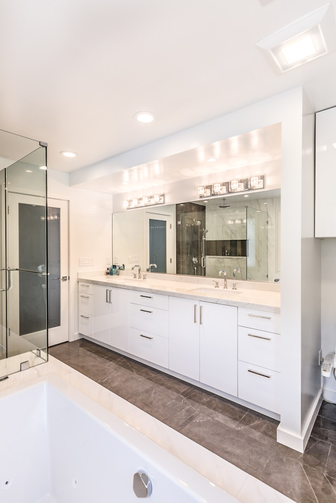 A spacious bathroom featuring a large tub and a separate shower area, designed for comfort and relaxation.